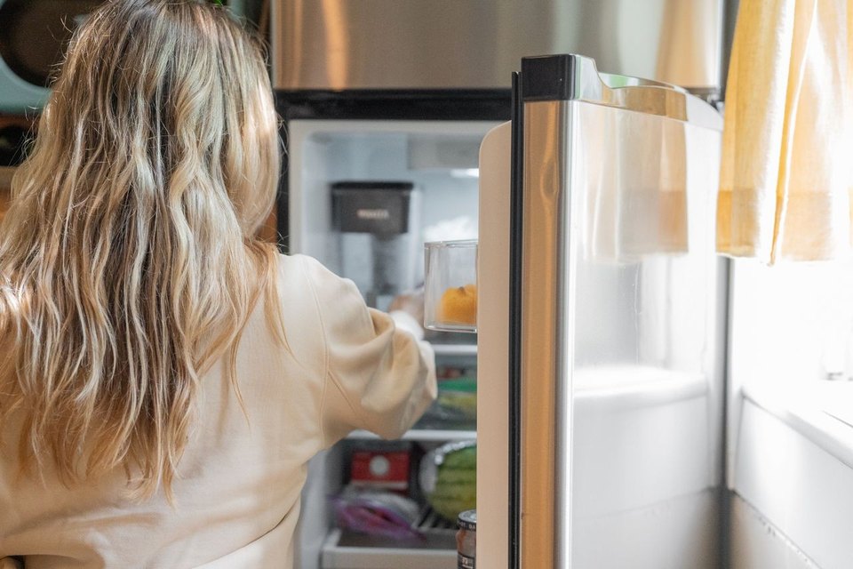 opening fridge with food in it